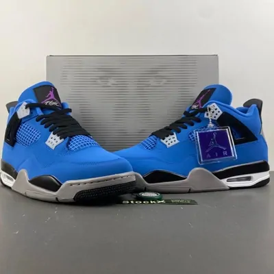Royal blue high-top sneakers with a white midsole, standing on a grey shoe box