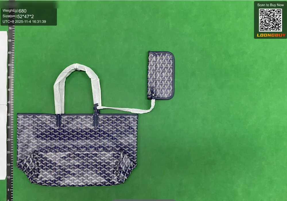 A patterned tote bag and a matching small pouch photographed together on the inspection bench