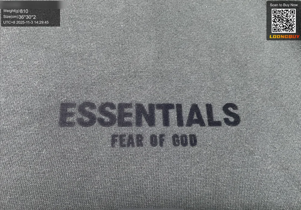 Close photo of a chest print on a dark hoodie showing the edge quality of the lettering
