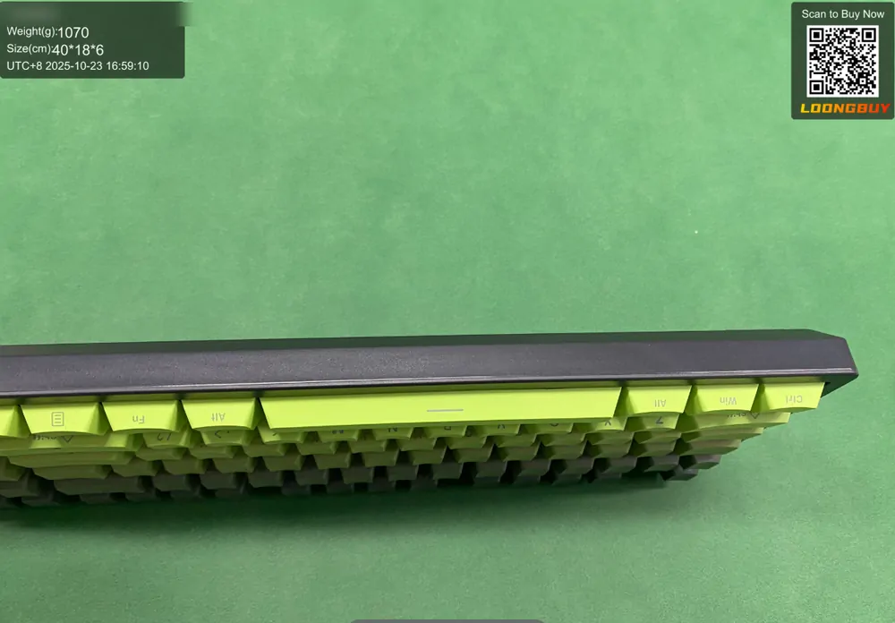Side view of a mechanical keyboard on the inspection bench showing the key height and the case edge